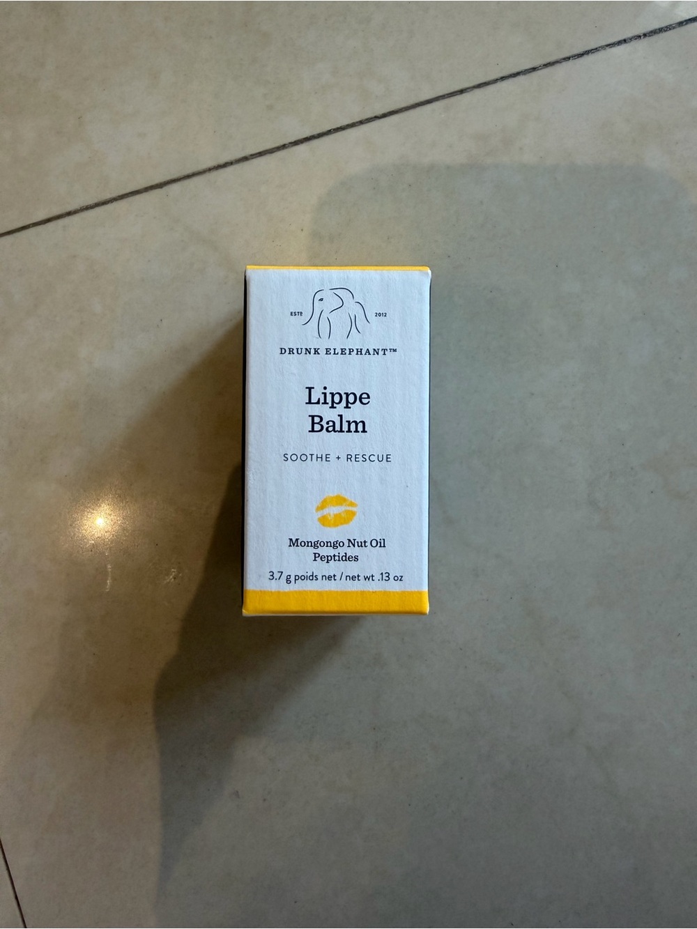 Drunk Elephant Lippe Balm — White with Yellow Accents